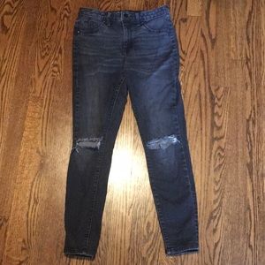 Distressed black-wash jeans.